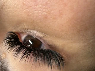 Close-up of a dramatic volume lash set with dense, dark fans