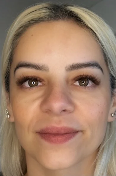 Client facing the camera with a soft, natural-looking lash set